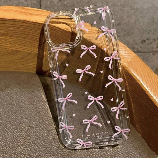 A clear plastic case for a smartphone with a pattern of pink bows and hearts.