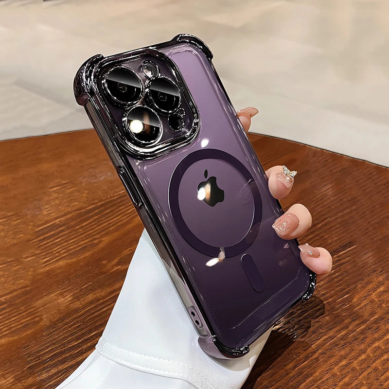 Hand holding a purple phone case with a clear back on a wooden surface