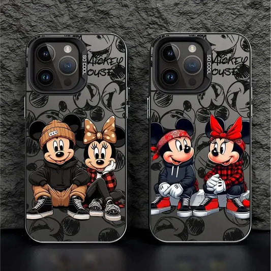 iPhone cases featuring cartoon characters Mickey and Minnie Mouse with a black and white floral pattern and red accents.
