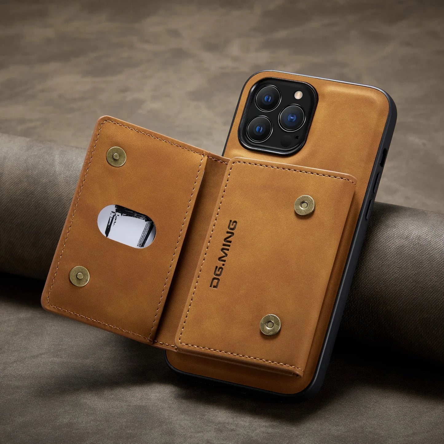 Brown phone case with card holder on a gray surface