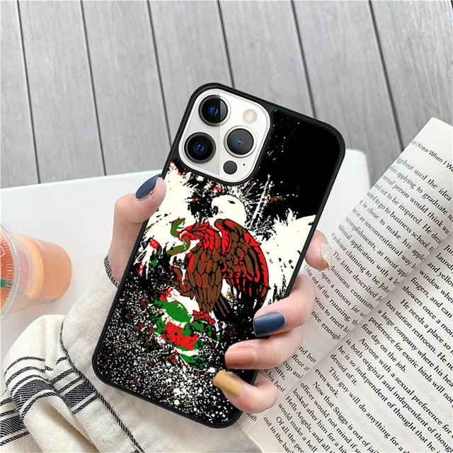 Phone case with eagle design held by a person on a wooden surface