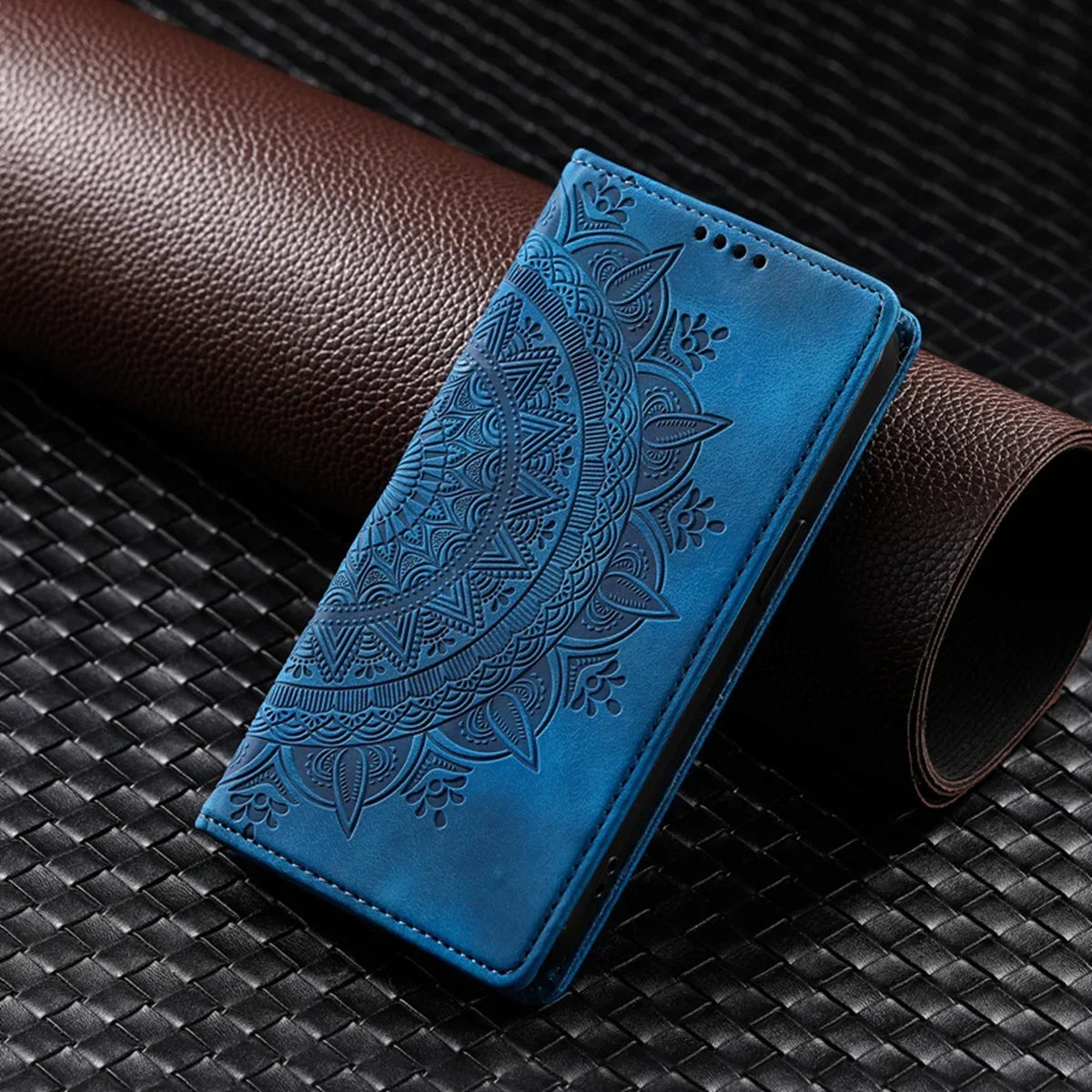 A pink leather flip case for a smartphone with floral embossed design, showing front and open views with card slots and a magnetic closure.