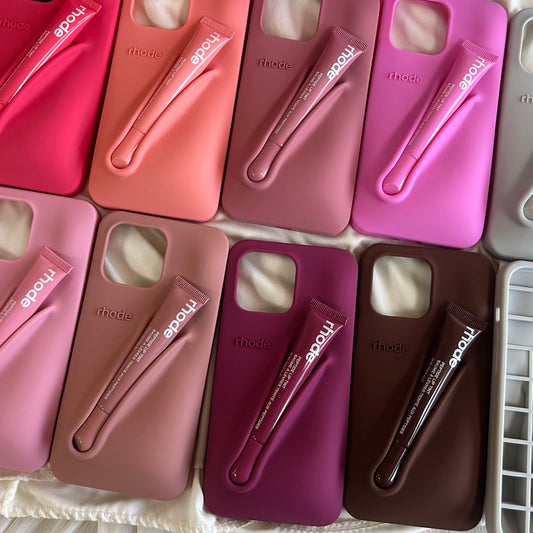 A collection of silicone holders for iPhone 16PM in various shades of pink, red, purple, and brown.