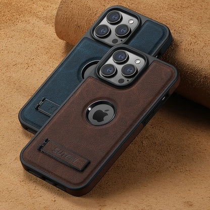 Two iPhone cases, one black and one brown, with a visible bracket attachment on the brown one, set against a textured background.
