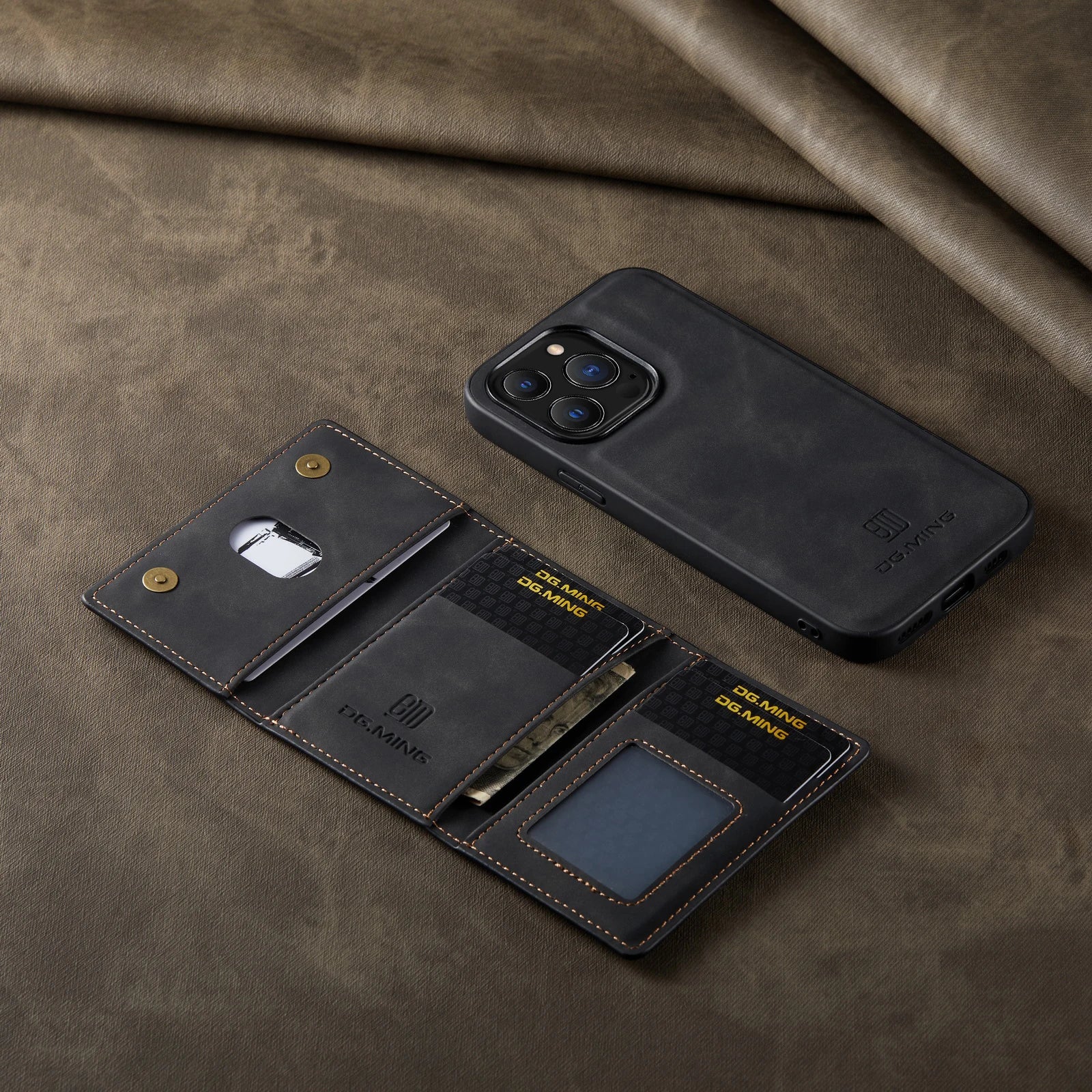 Black phone case and wallet set on a brown fabric background